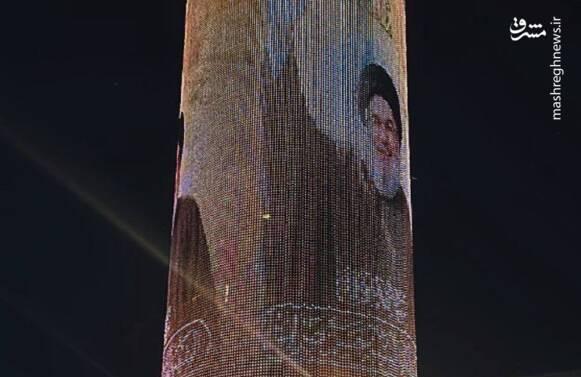 تصویر شهید نصرالله بر روی مرکز خریدی در بغداد