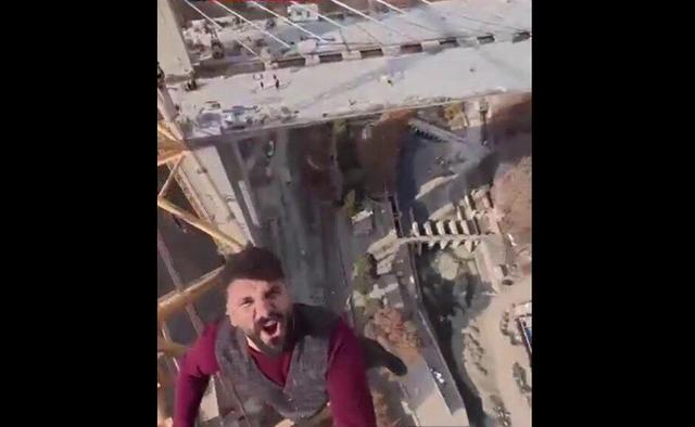 حرکت تازه بلاگر «وضعتان چونه؟» جنجالی شد+ ویدئو | راه رفتن روی لبه باریک جرثقیل بدون تجهیزات ایمنی!