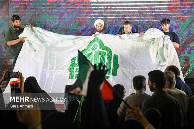 پرچم نجف در بارگاه رضوی؛ رایحه کربلا در مشهد